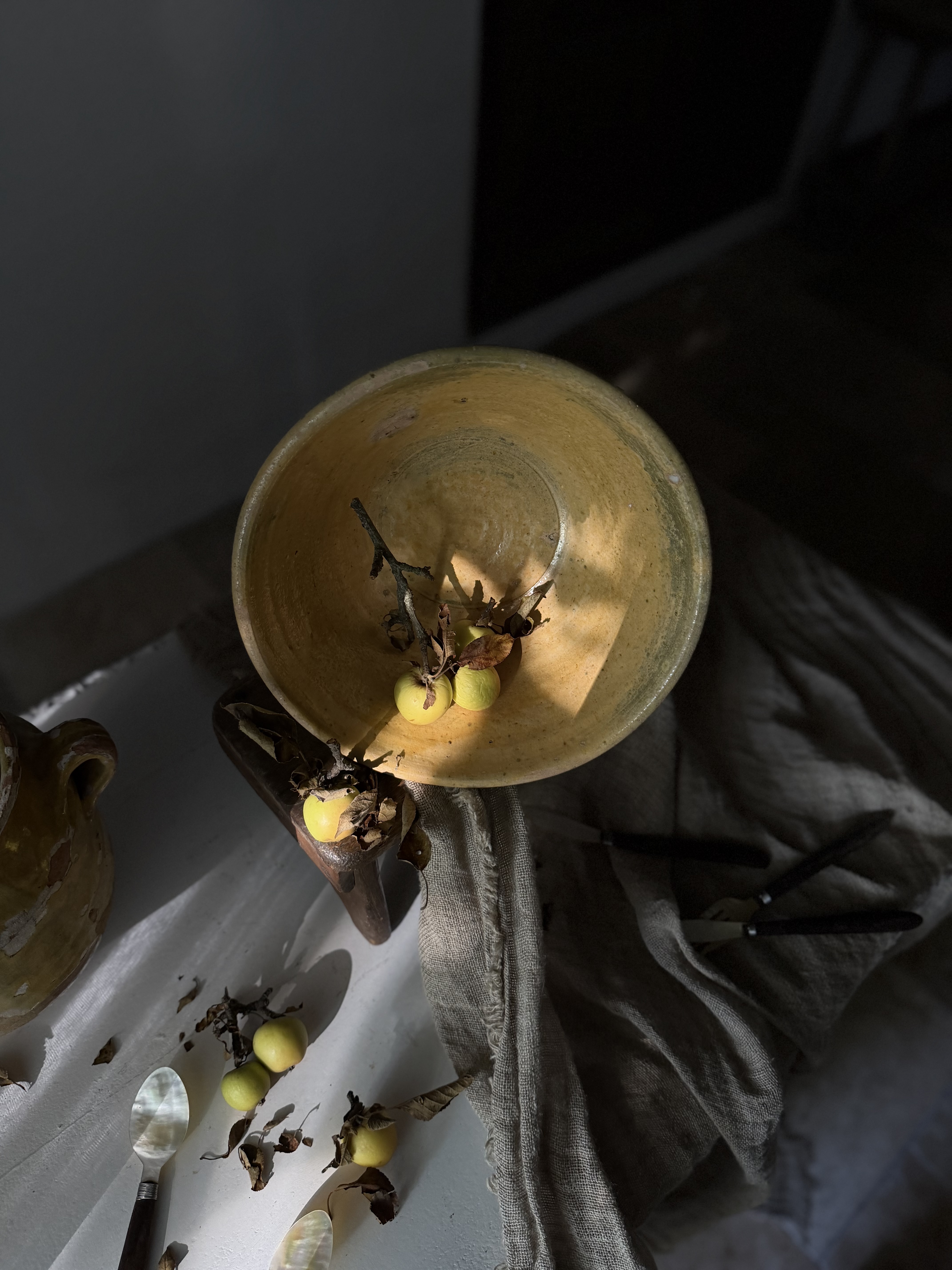 Top-down view of the sunlit interior of the antique ochre pottery tian
