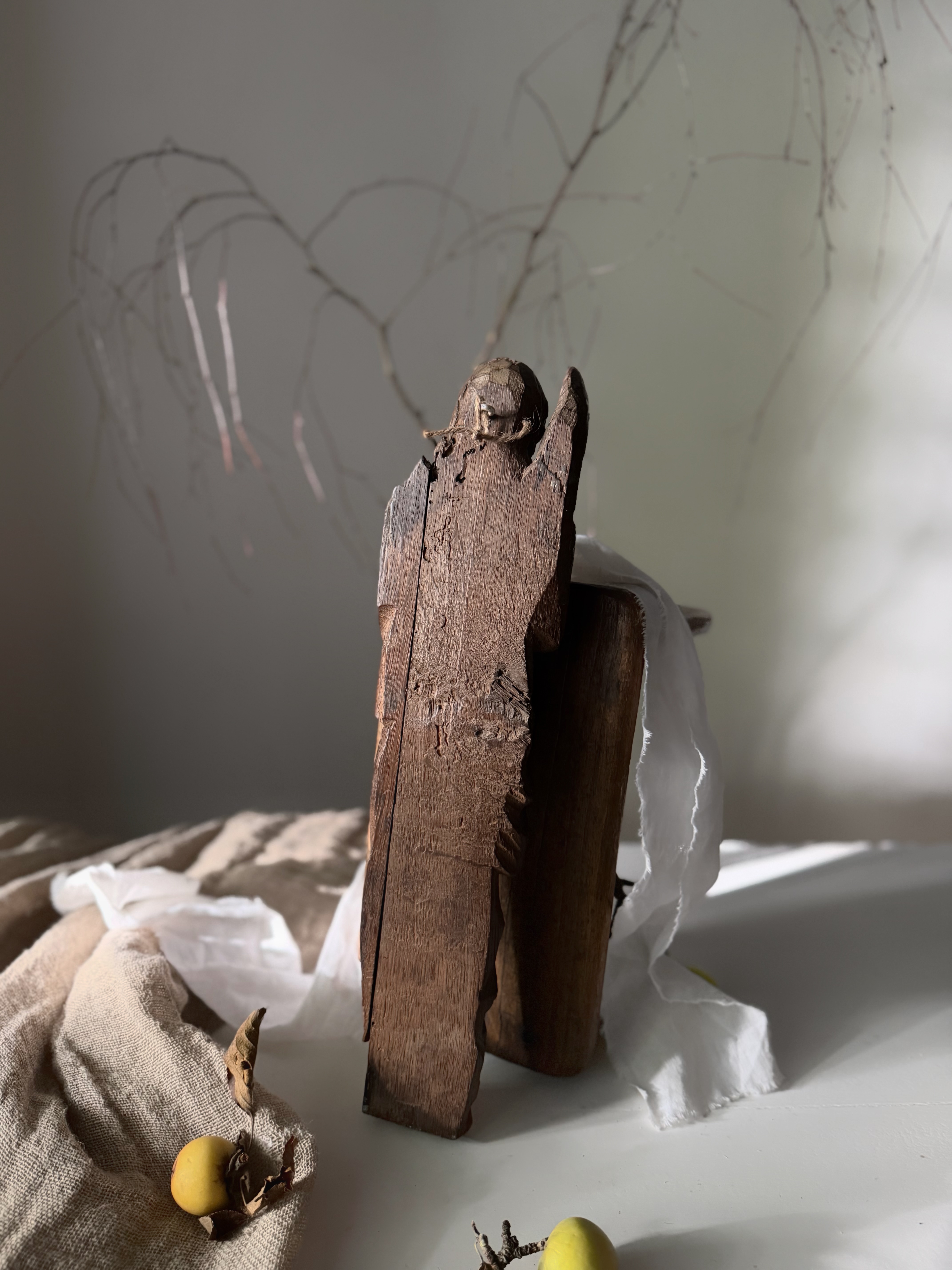 The flat reverse of the carvings showing historical inactive woodworm