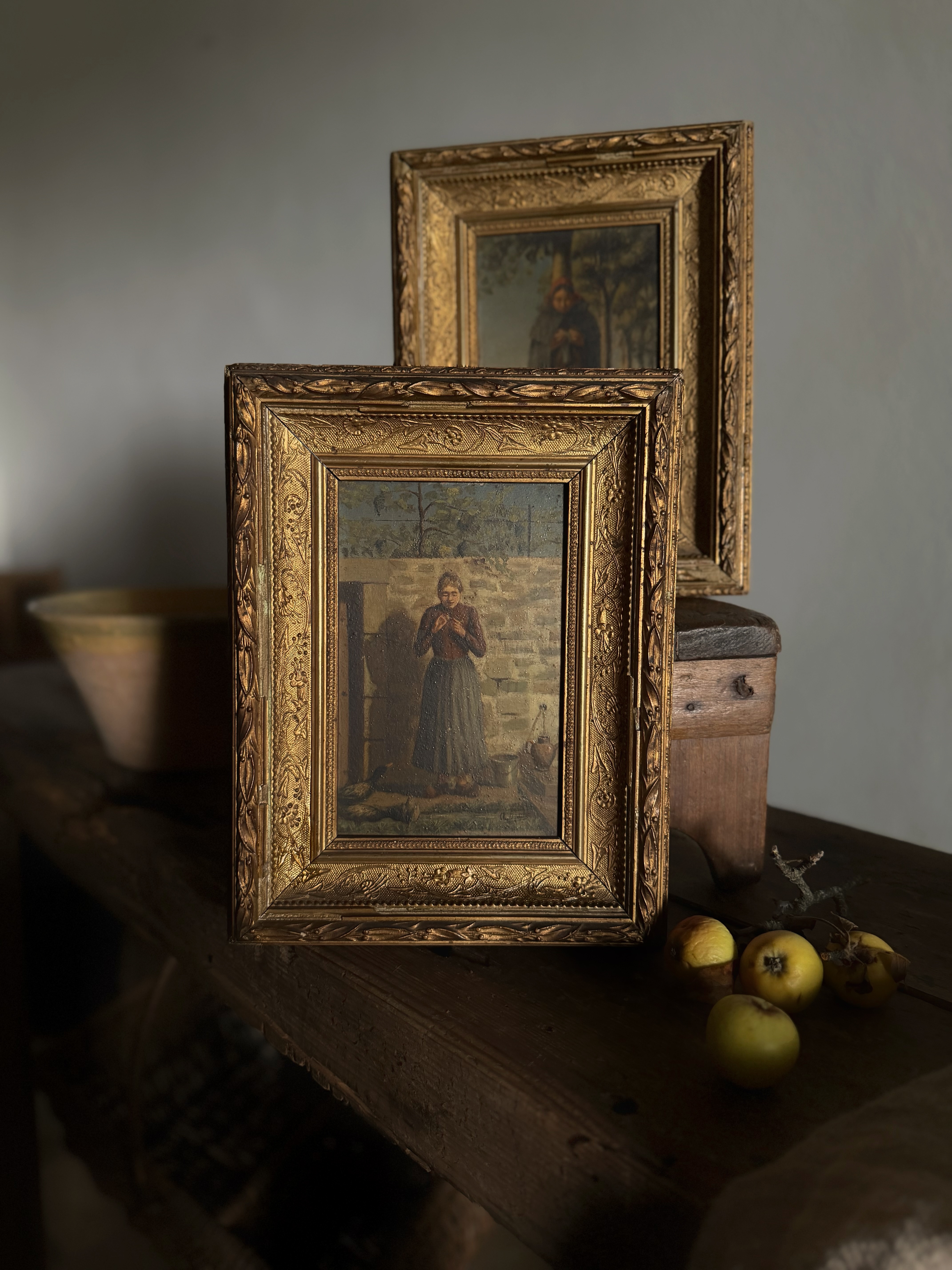 Pair of antique French oil paintings in chipped gilt frames
