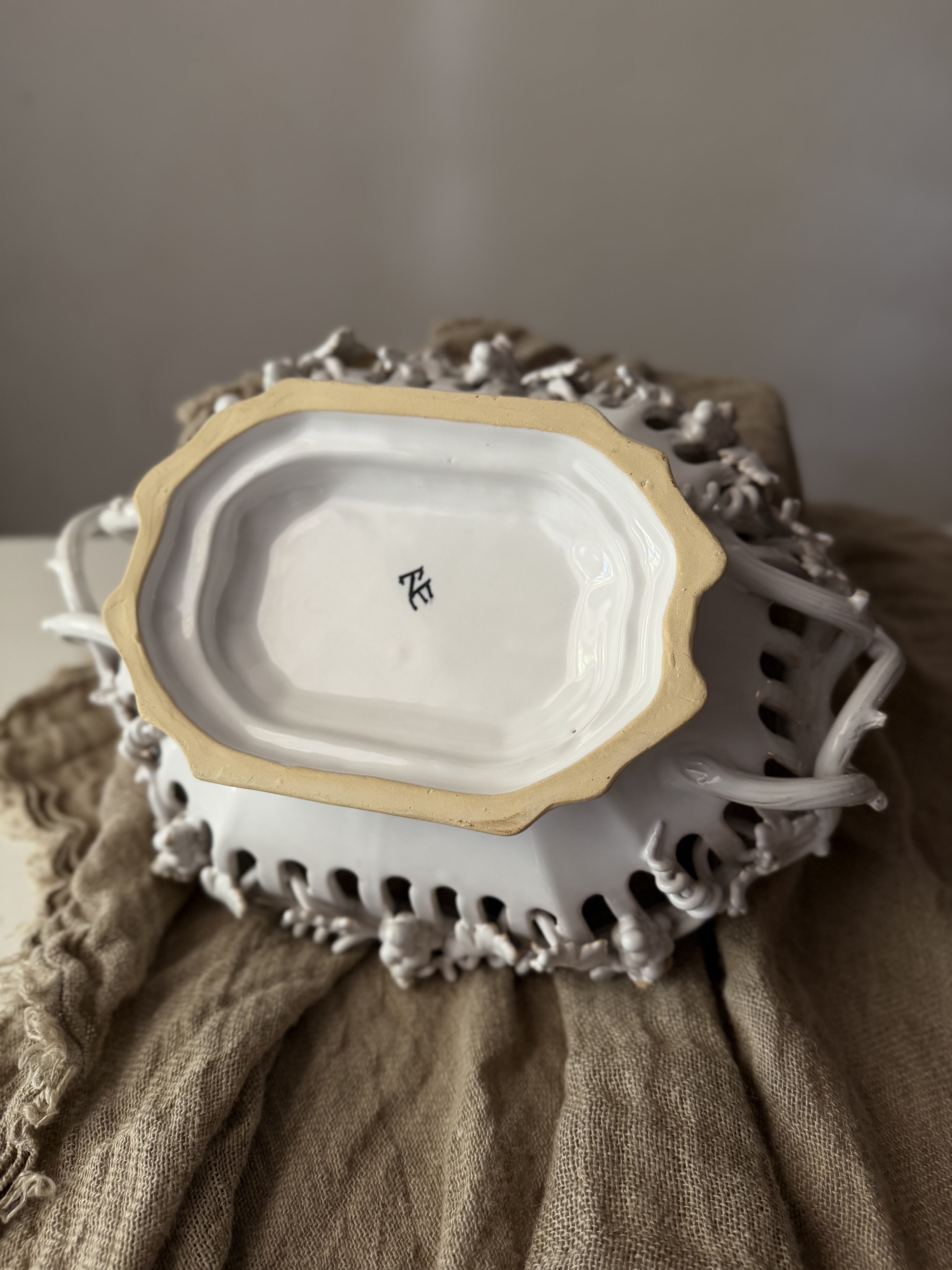 The unglazed base showing the hand-painted ET cipher